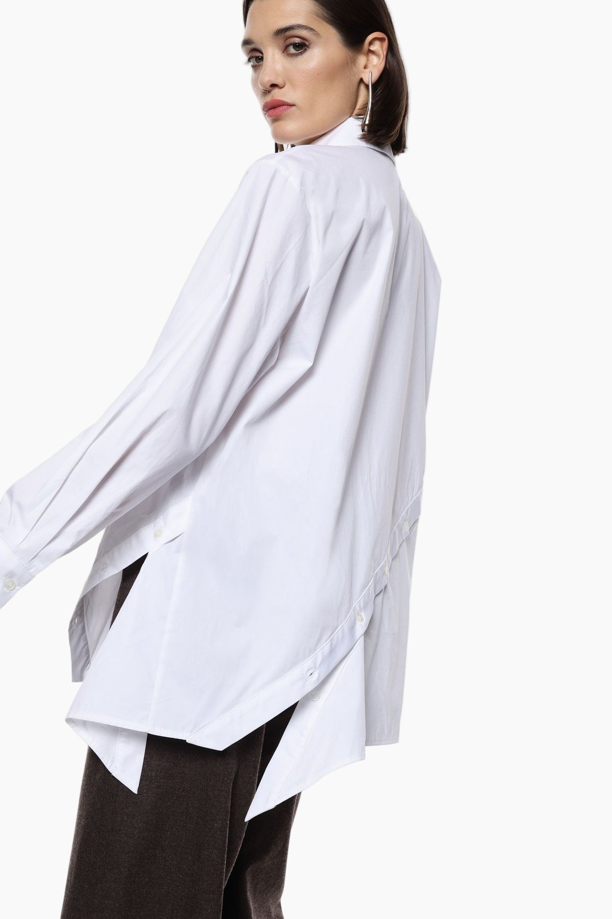Woman wearing a white oversized shirt