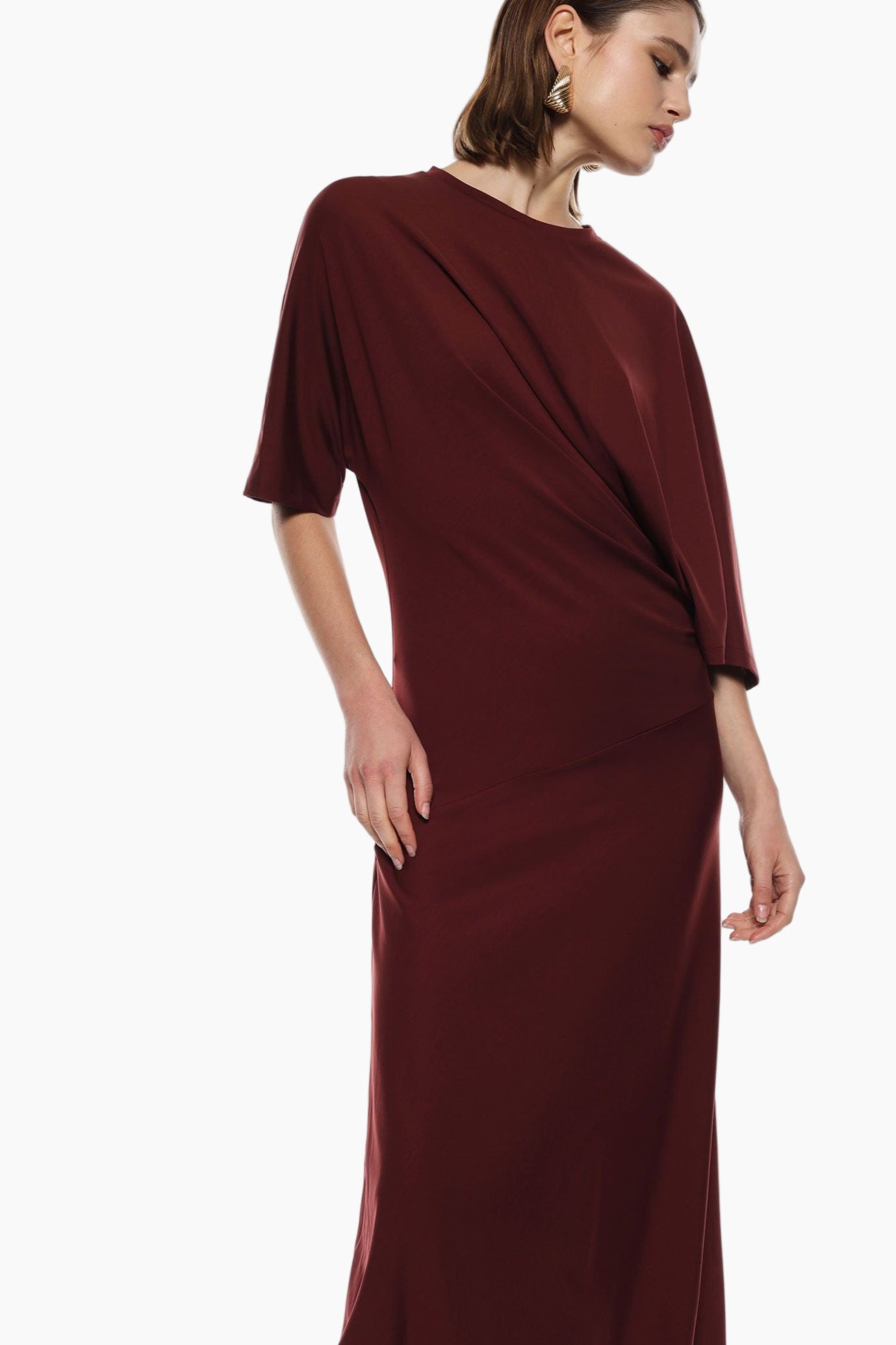 Burgundy evening gown with draped design
