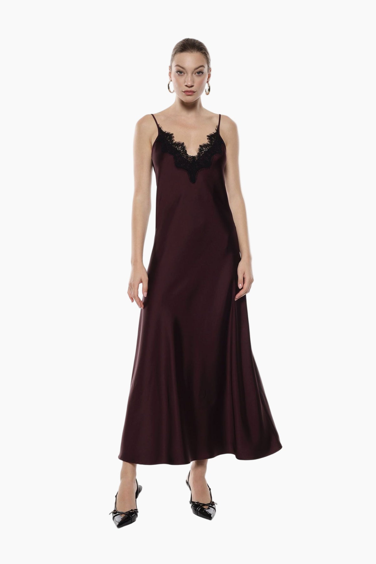 Woman wearing a burgundy sleek slip dress with lace details