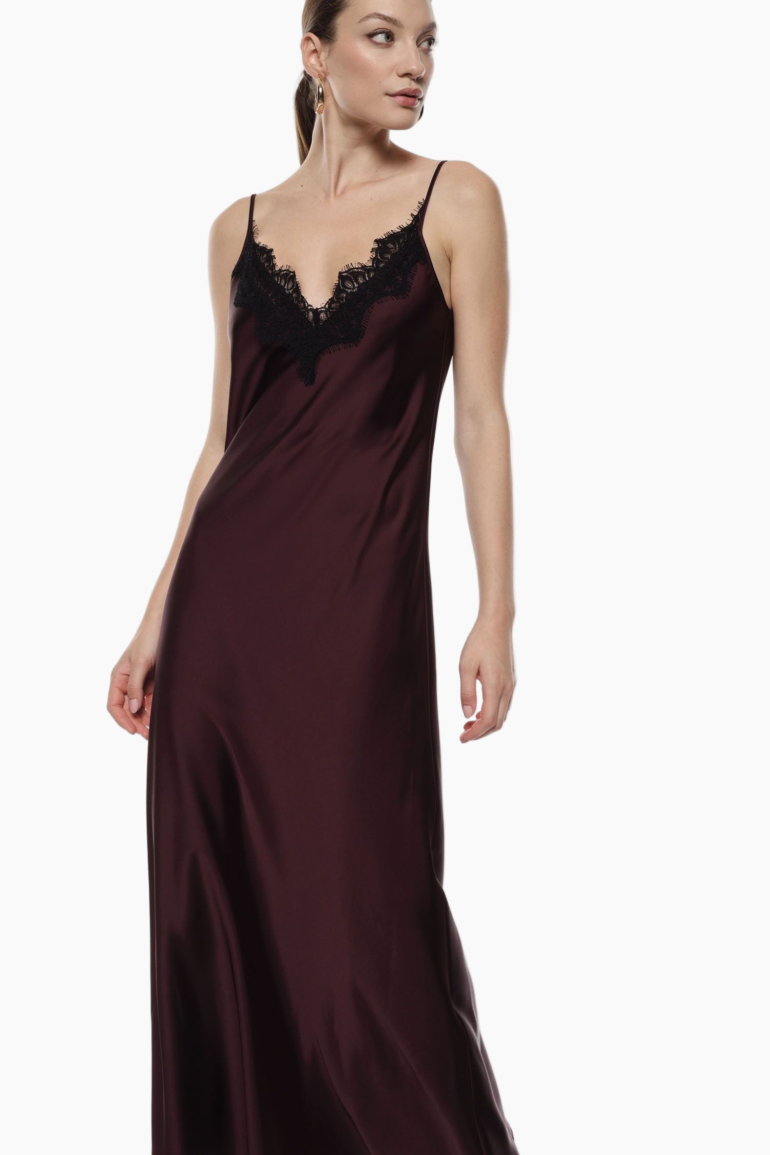 Woman wearing a burgundy satin nightgown with lace trim