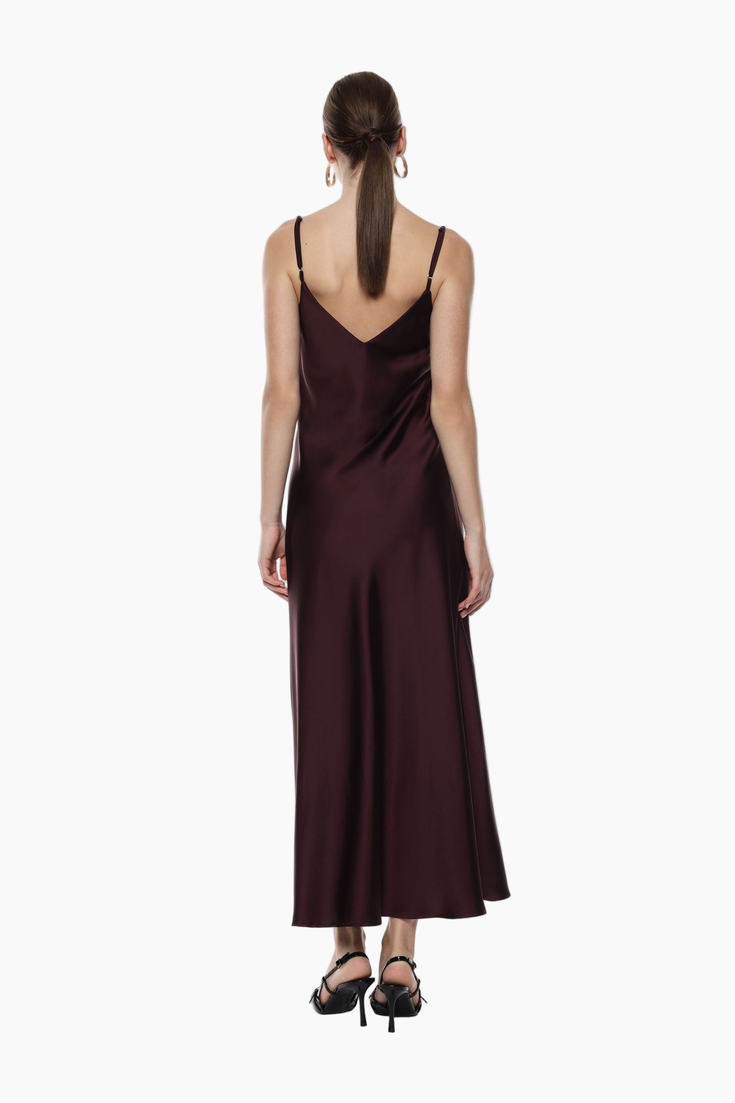 Woman wearing a burgundy slip dress