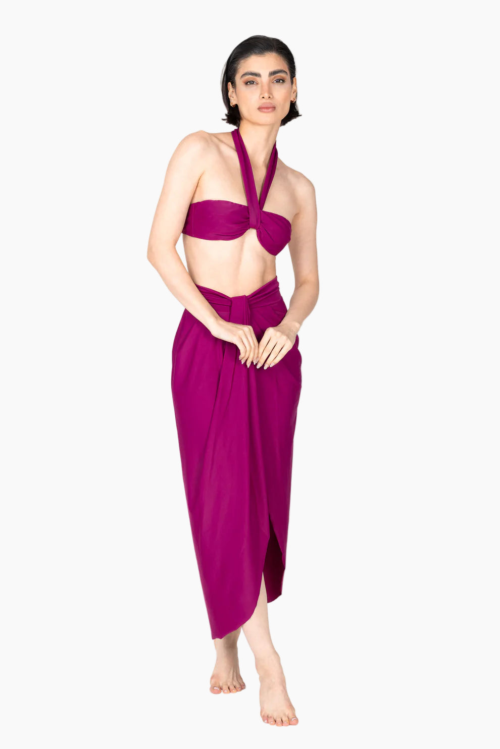 Woman in a 4-piece outfit purple bikini set , with a long matching cover up