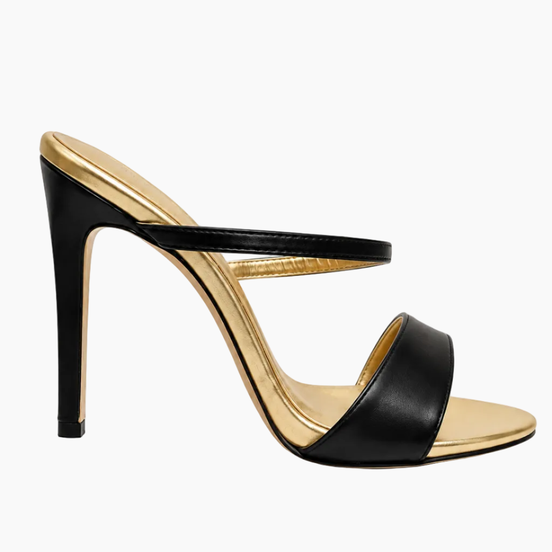 A single black leather high-heeled sandal with a metallic gold inner sole and heel accent, shown from a side profile on a white background.