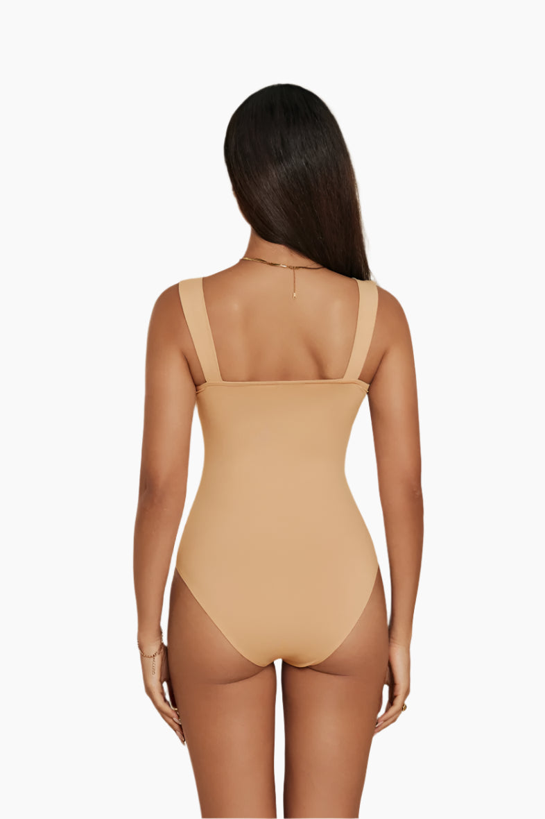Beige bodysuit worn by a model