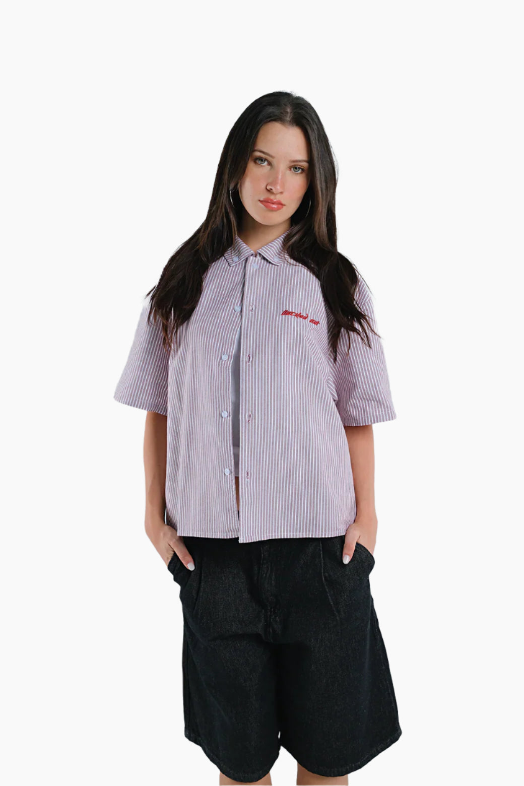 Woman wearing a striped shirt and black shorts