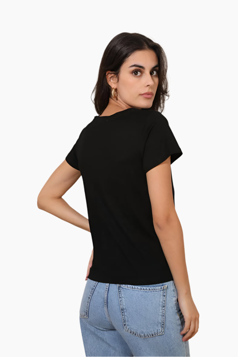 Woman wearing a black t-shirt and light blue jeans