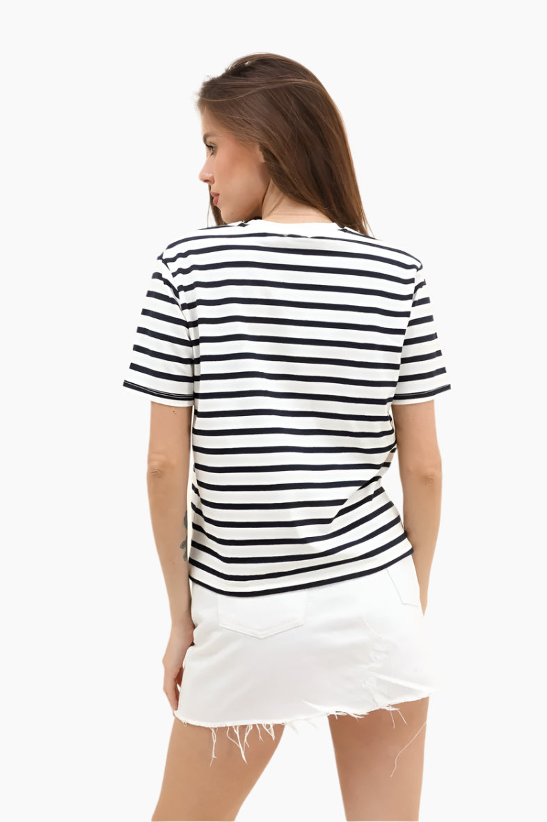 Woman wearing a black and white striped shirt