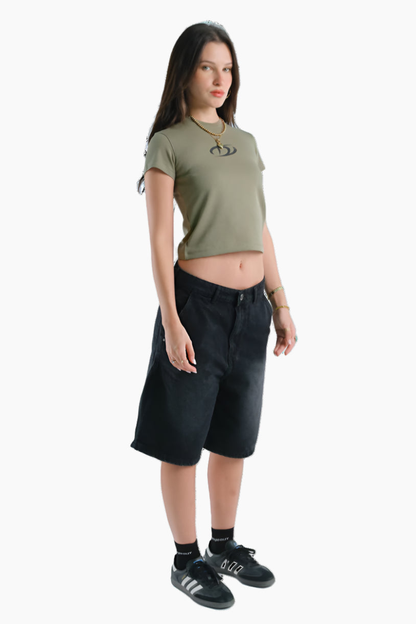 Person wearing a green t-shirt and black shorts