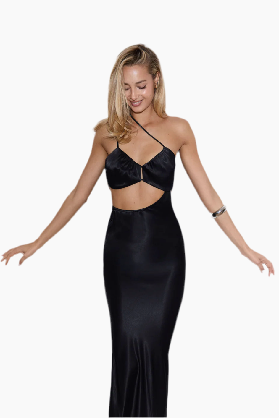 Woman wearing a black dress with cut-out design.