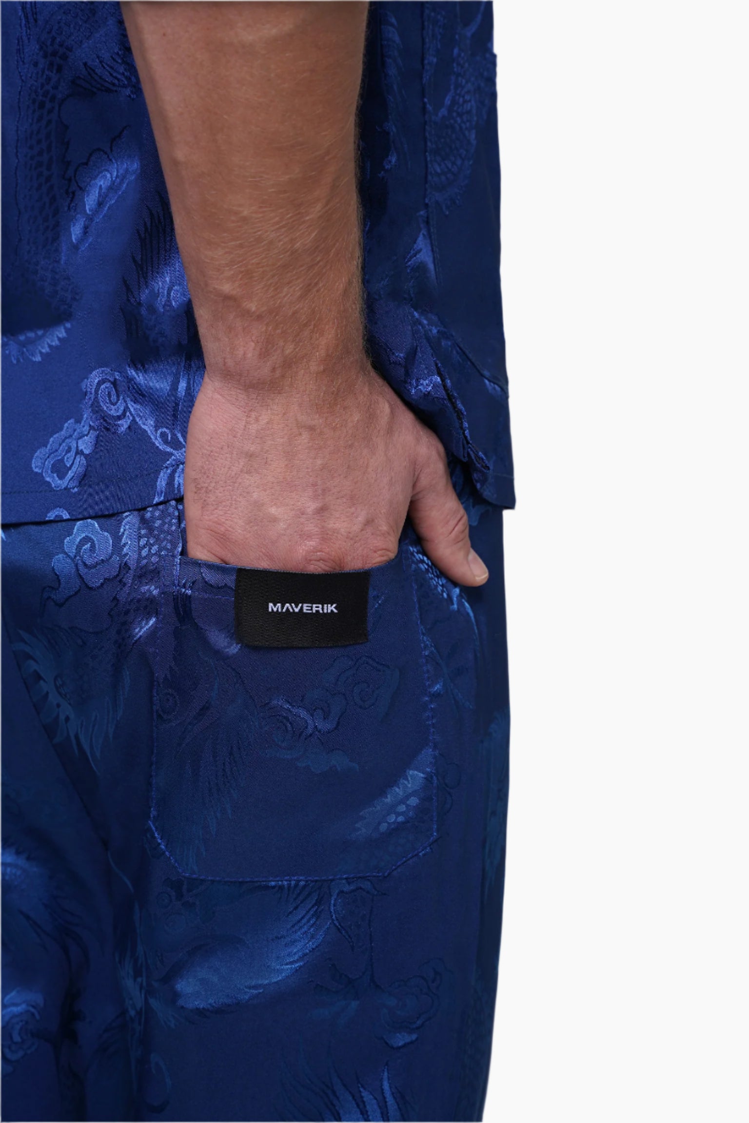 Close-up of a blue patterned garment with a visible brand label