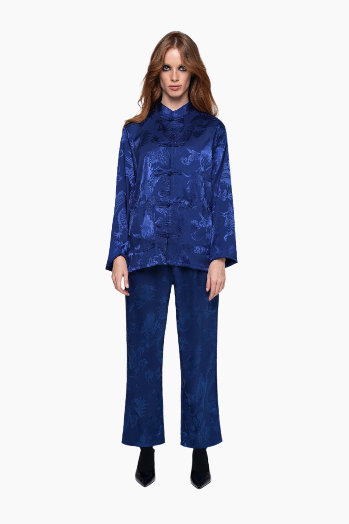 Woman wearing a blue patterned top and pants