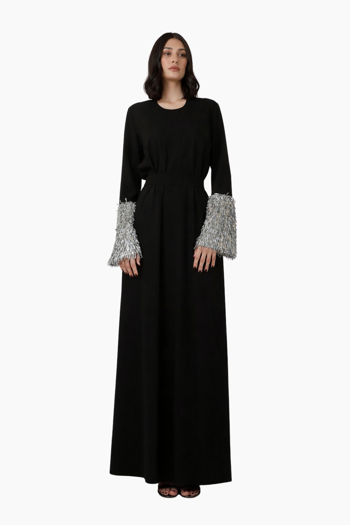 Black dress with silver cuffs on a white background