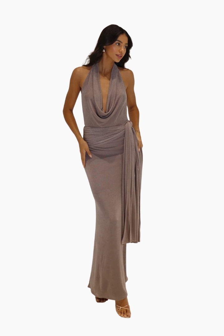 Woman wearing a long, flowing dress on a white background