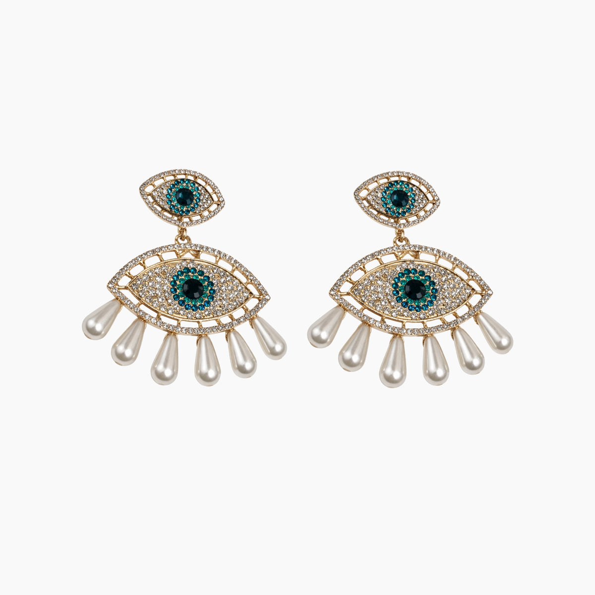 Pair of eye-shaped earrings with gemstones and pearl-like elements on a white background