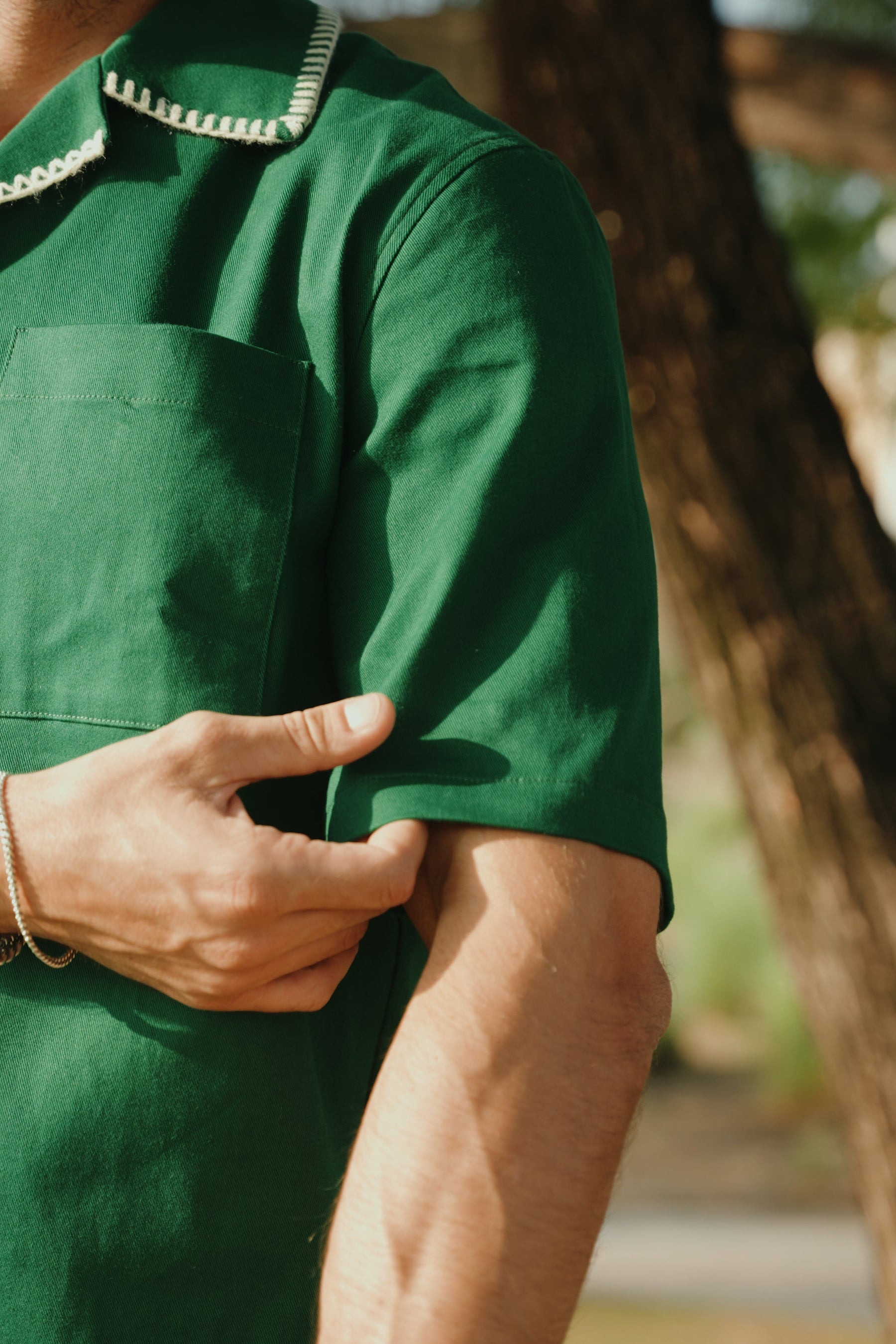 Person wearing a green apron