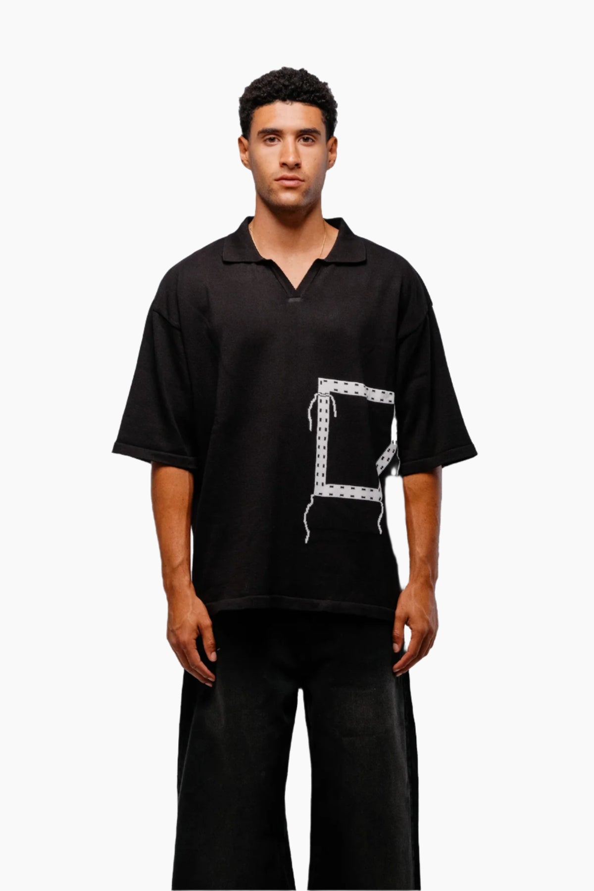 Man wearing a black t-shirt with a unique design pocket