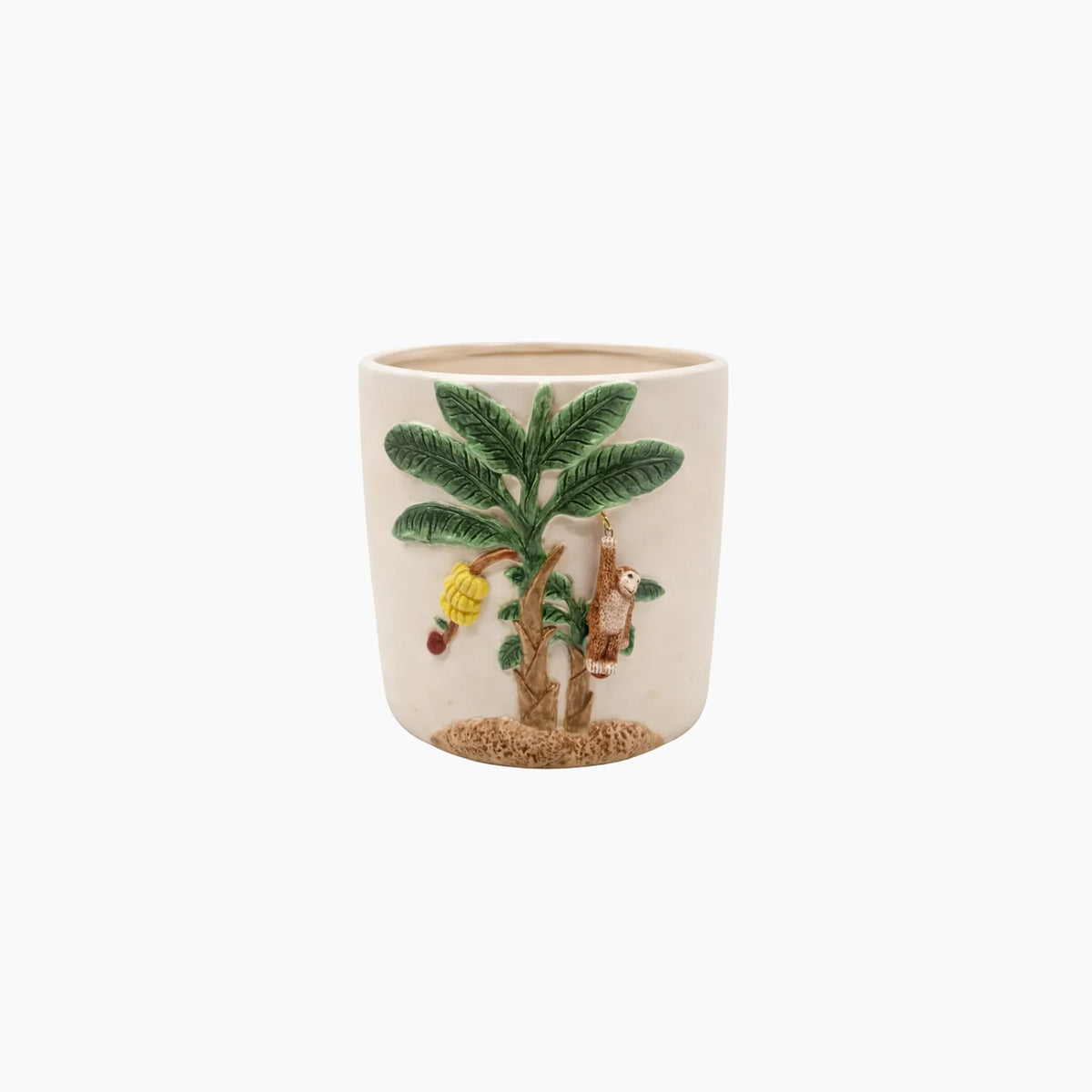 Ceramic cup with a palm tree and monkey design on a white background