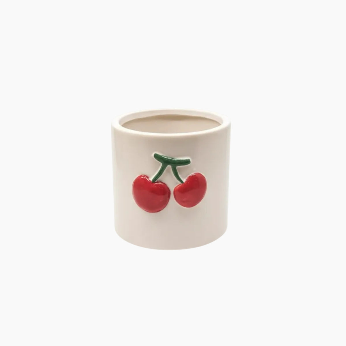 Ceramic container with red cherries on a white background
