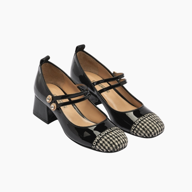 Black high-heeled shoes with patterned toes