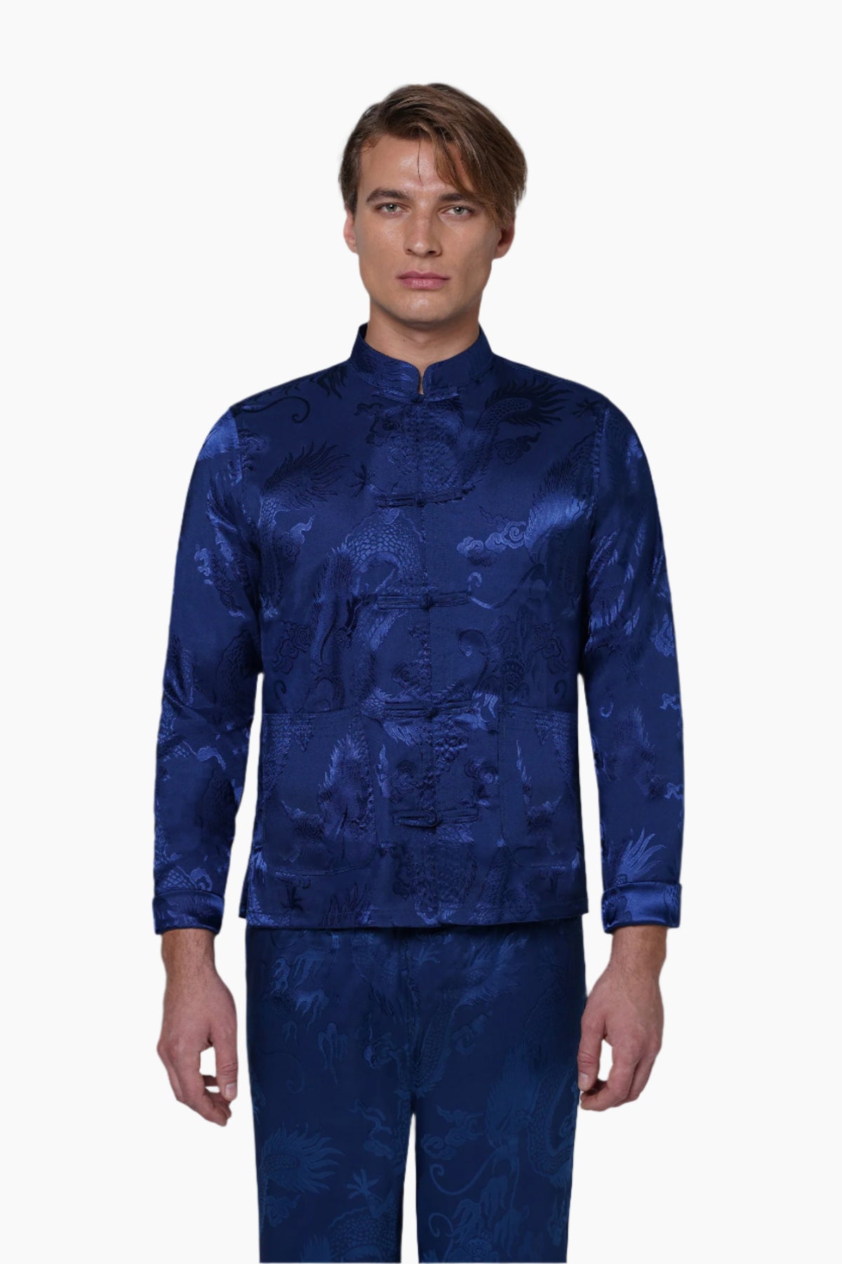 Man wearing a blue patterned shirt and pants