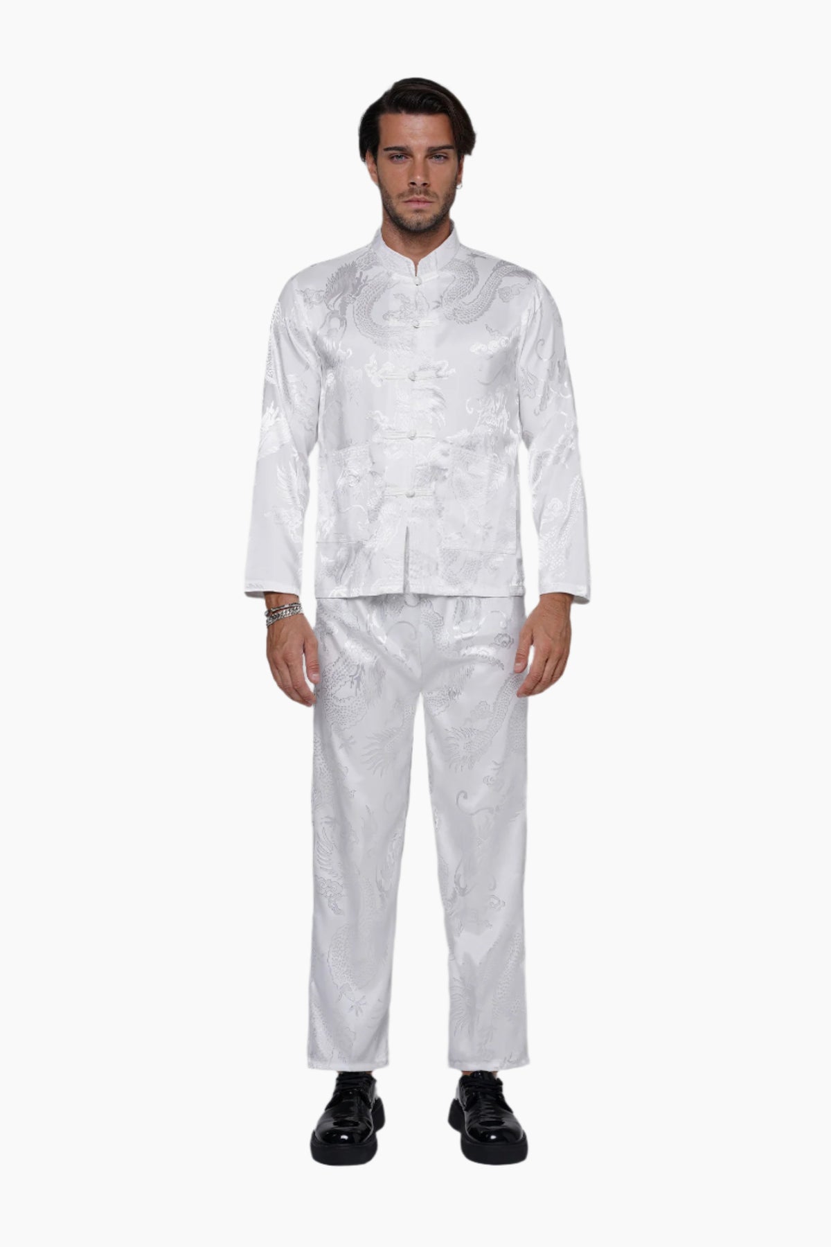 Man wearing a white patterned suit