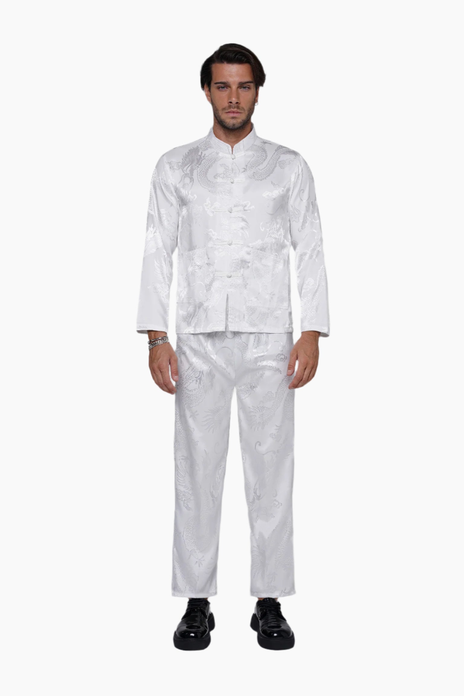 Man wearing a white patterned suit