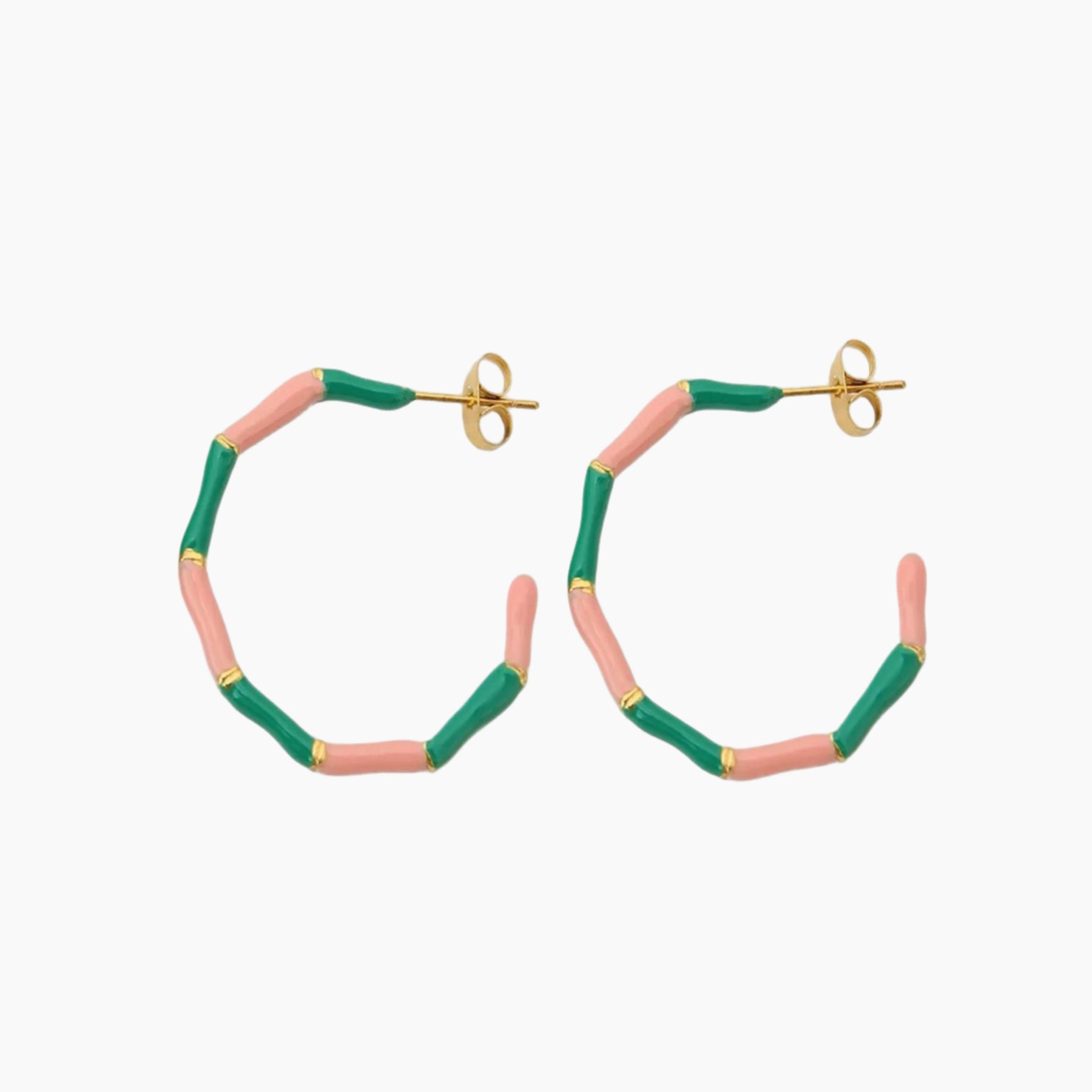 Hoop earrings with pink and green bands on a white background