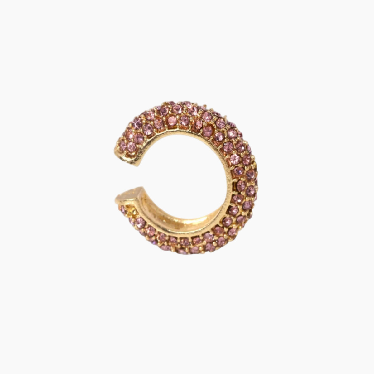 Gold and pink gemstone earring on a white background