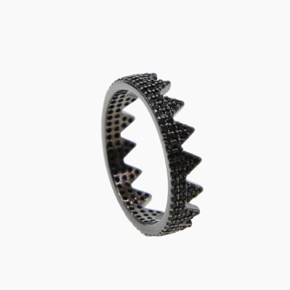 Silver ring with black gemstones on a white background