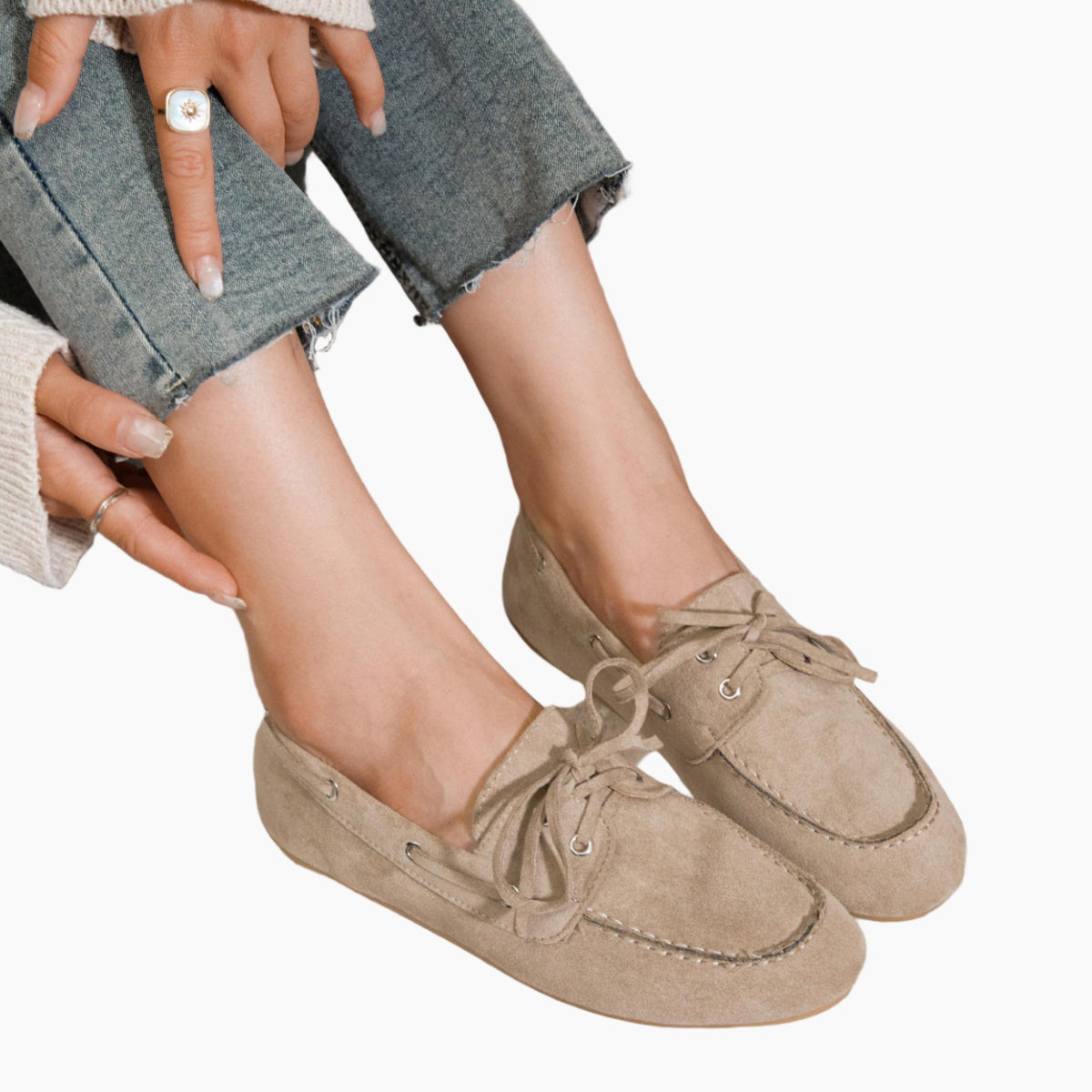 Person wearing beige loafers