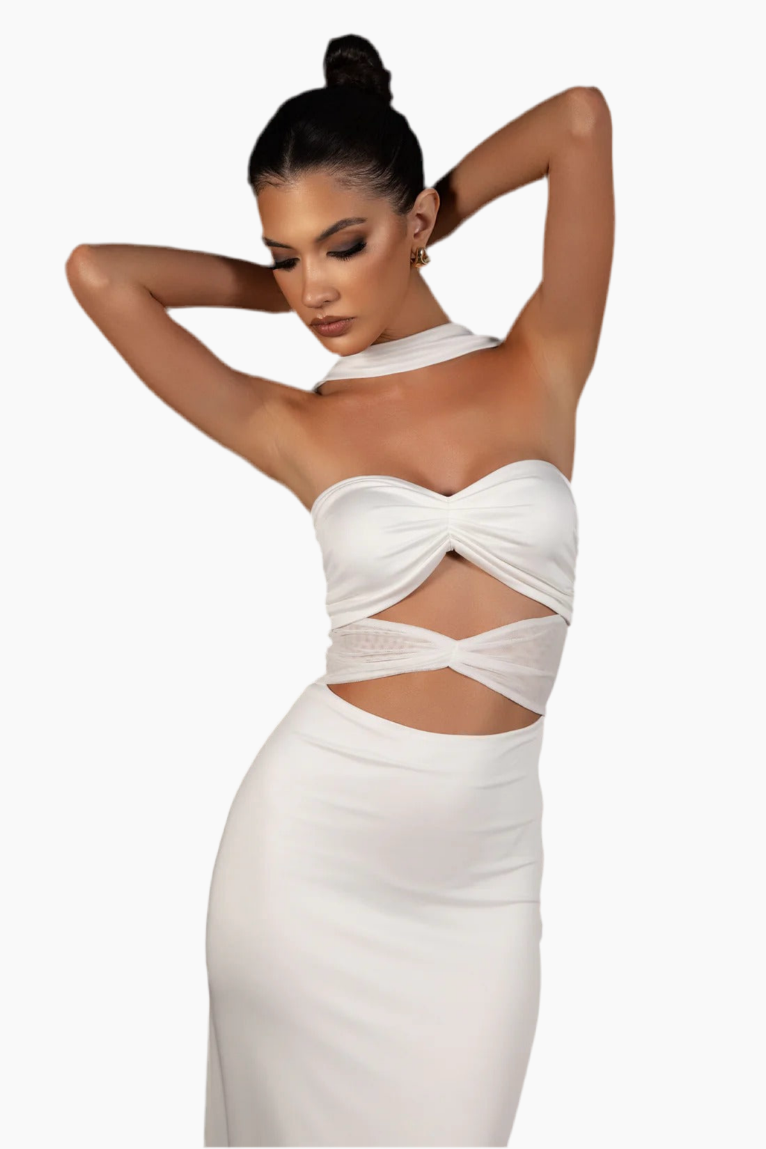 Woman wearing a white dress with cut-out design.