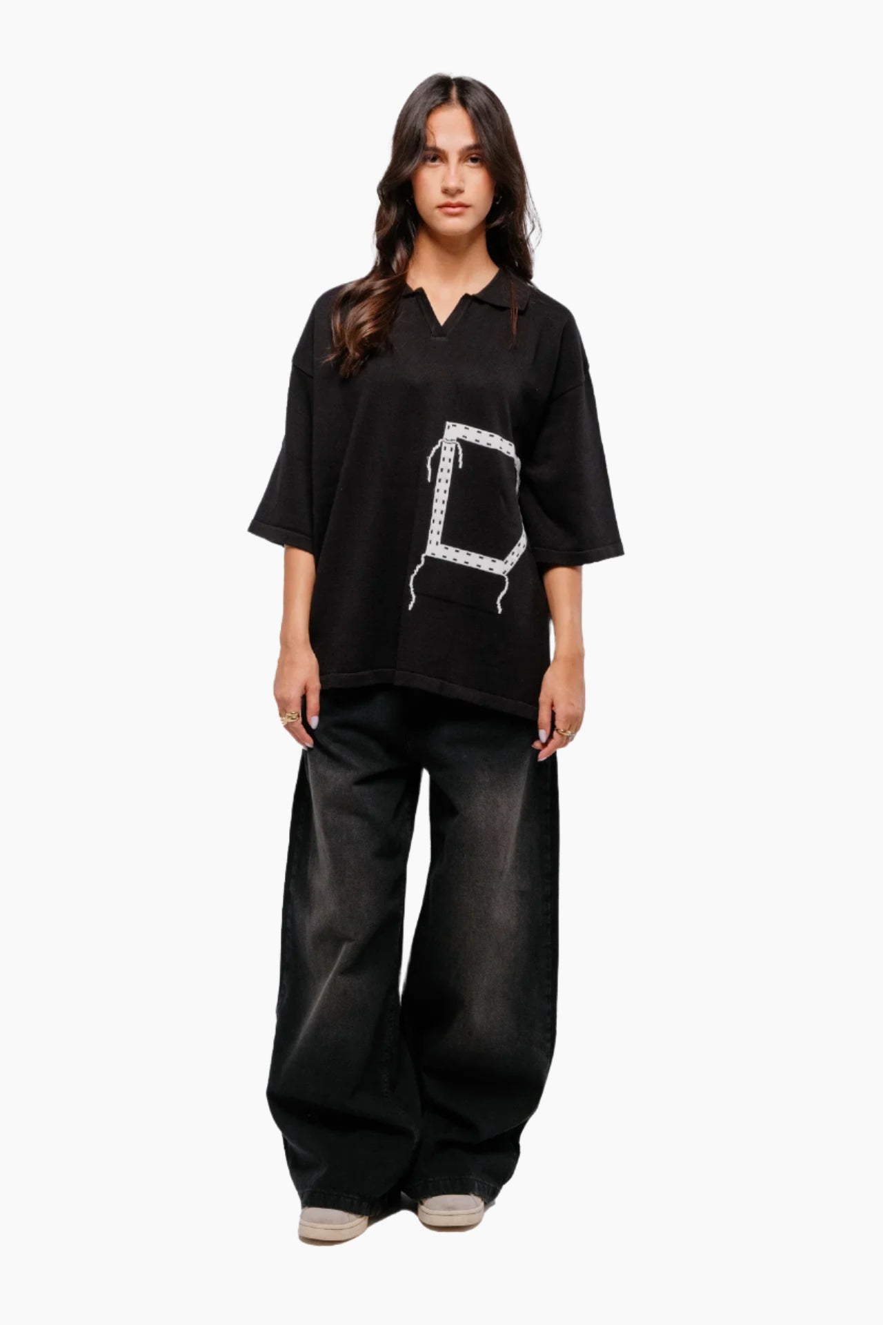 Woman wearing a black t-shirt with a unique design pocket