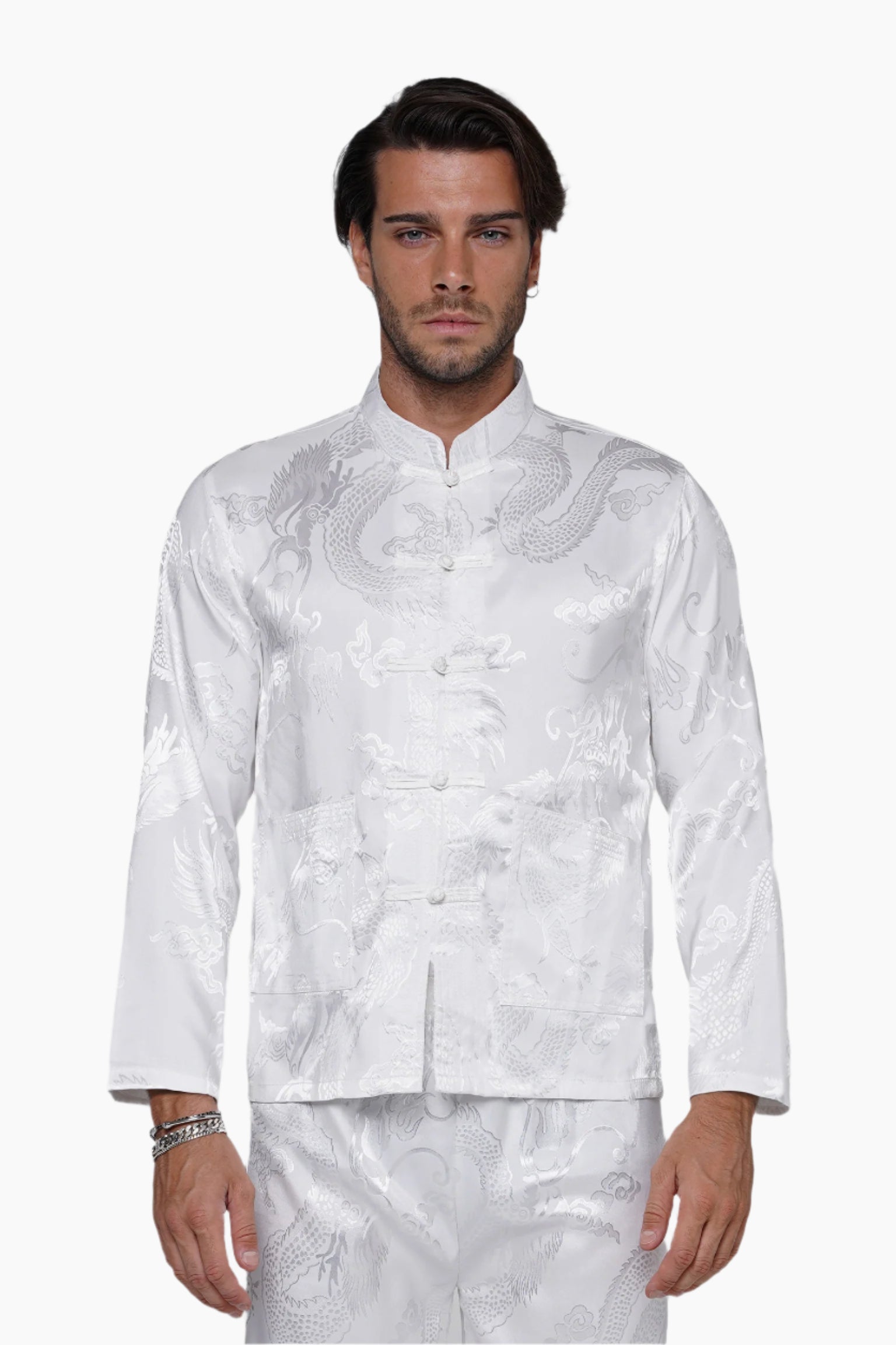 Man wearing a white traditional outfit on a white background
