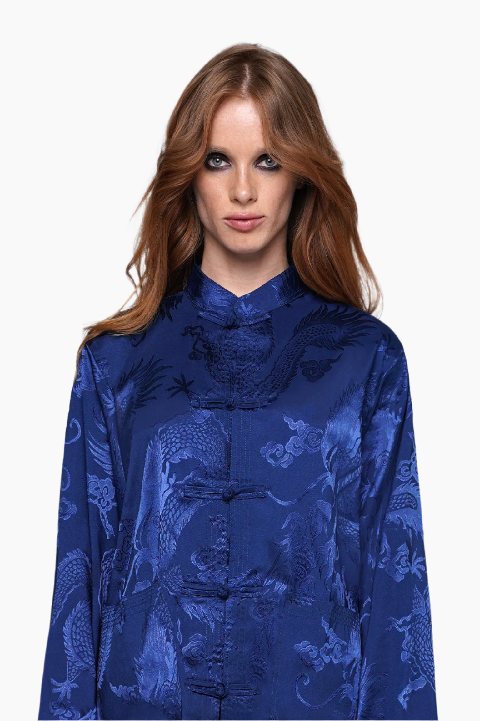 Woman wearing a blue patterned top and pants