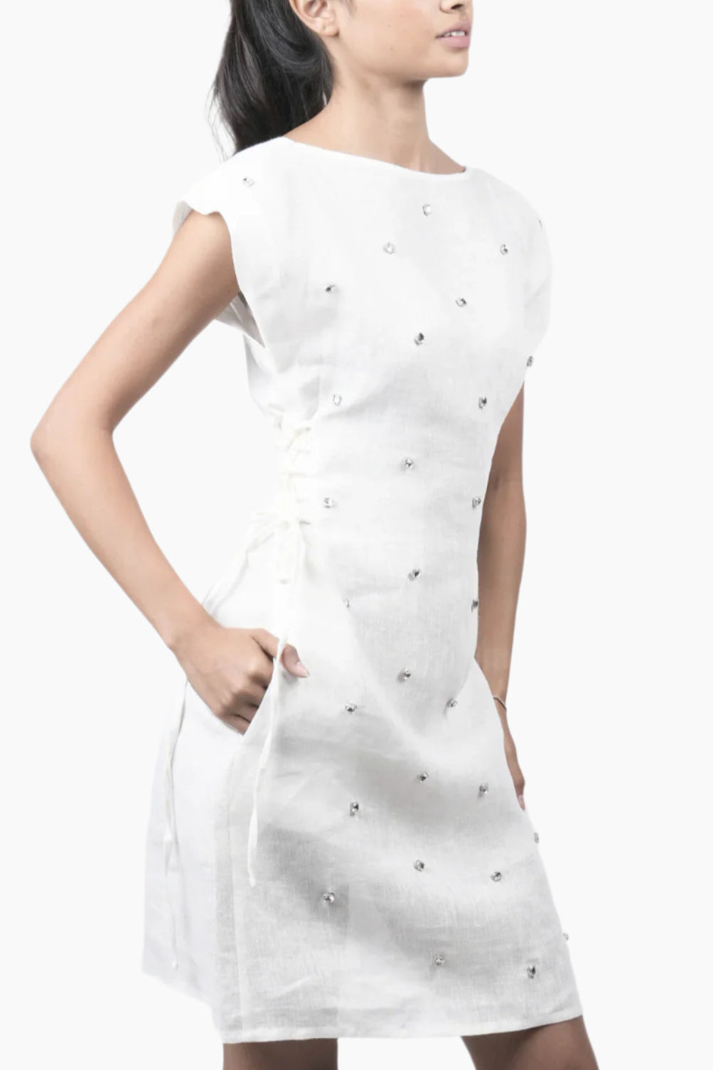 This crystal embroidered mini-Dress features elegant side lace-up detailing for a flattering, adjustable fit.
