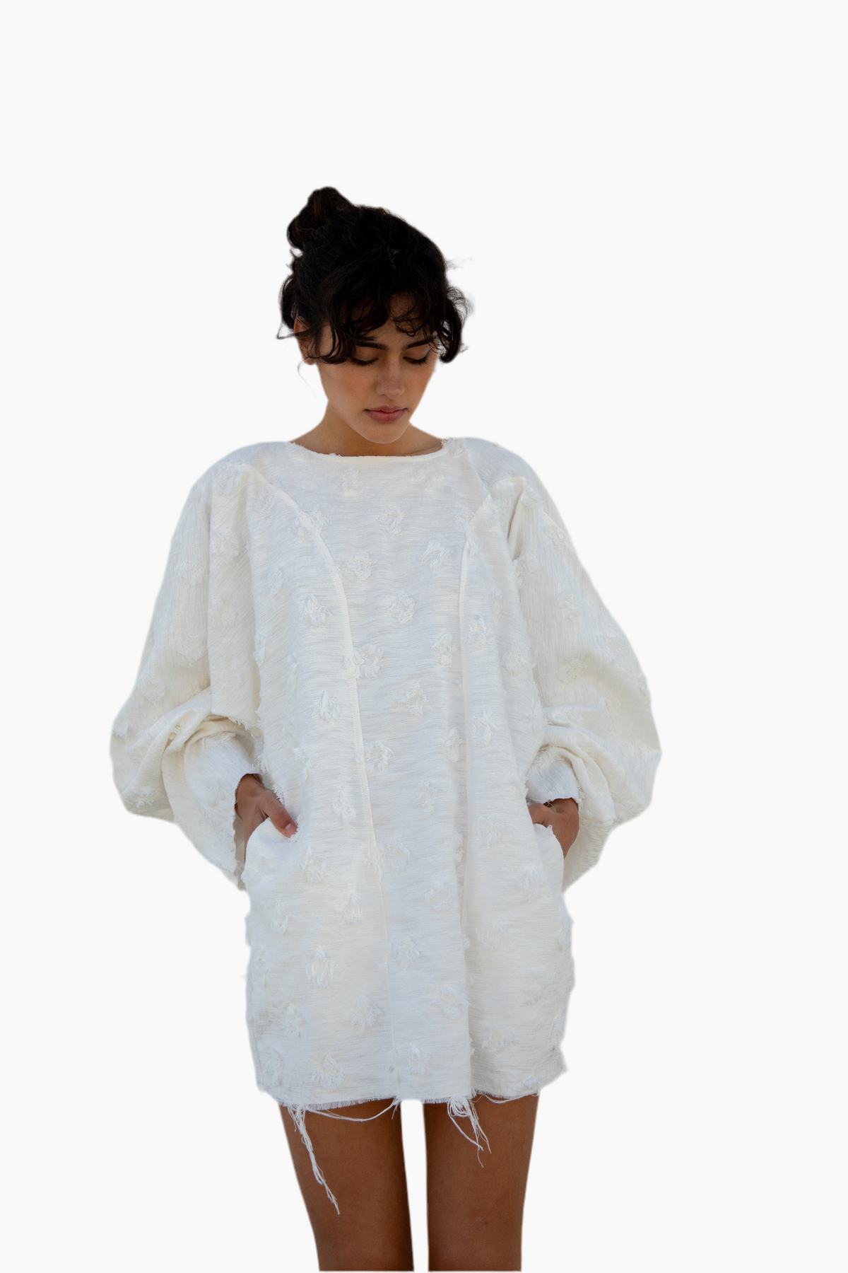 Woman wearing a white textured sweater