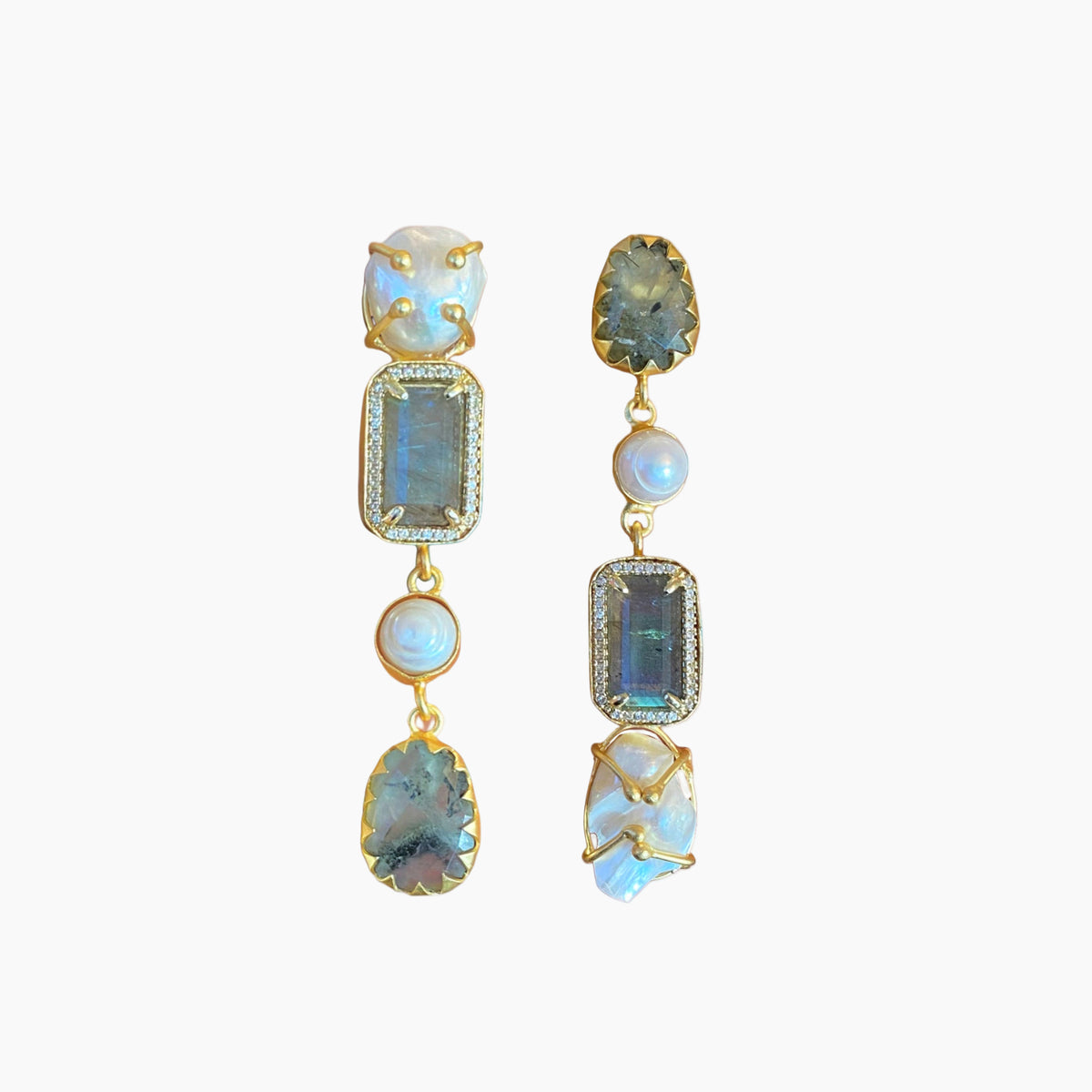 Pair of gold earrings with gemstones