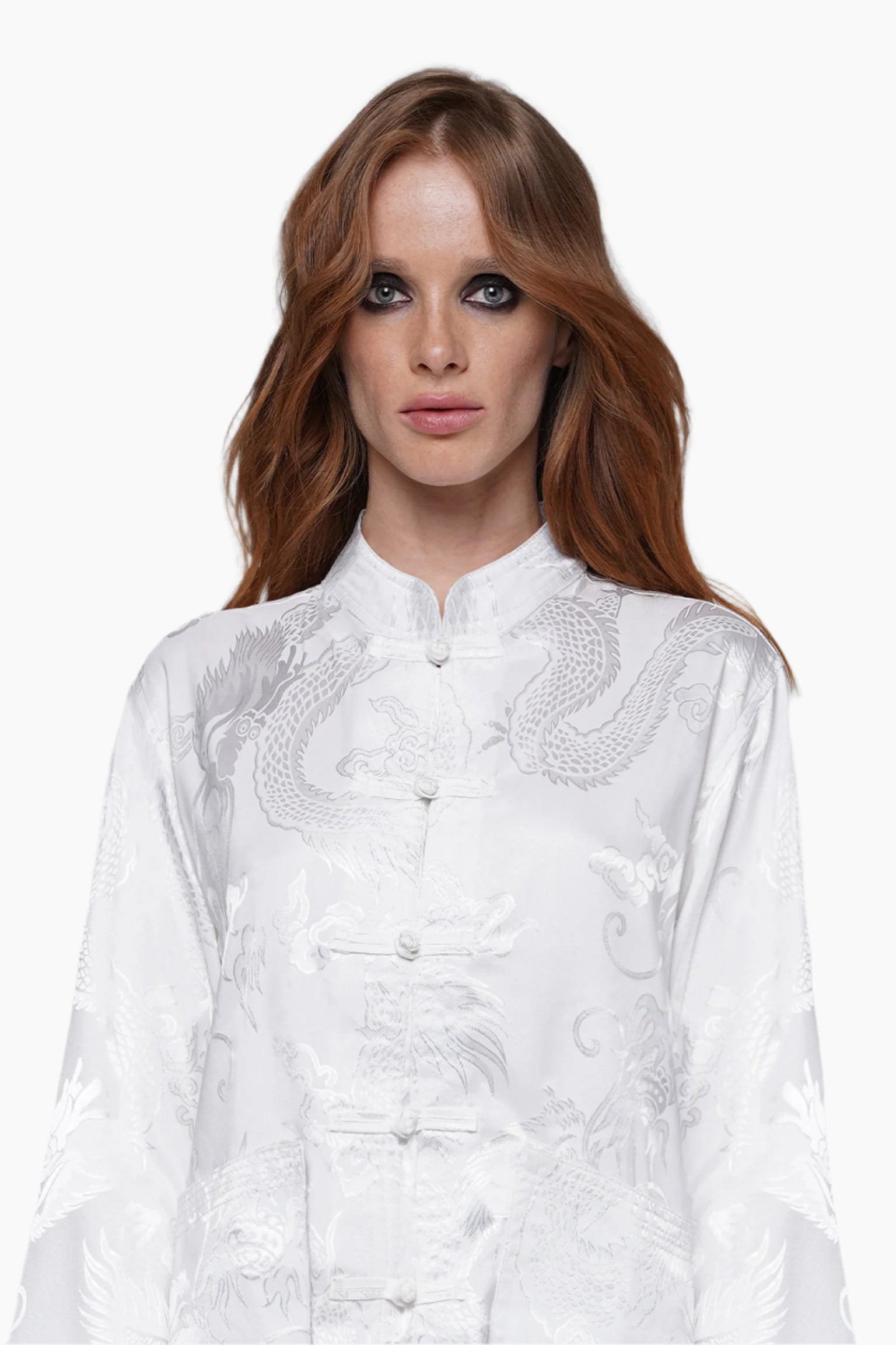 Woman wearing a white embroidered blouse