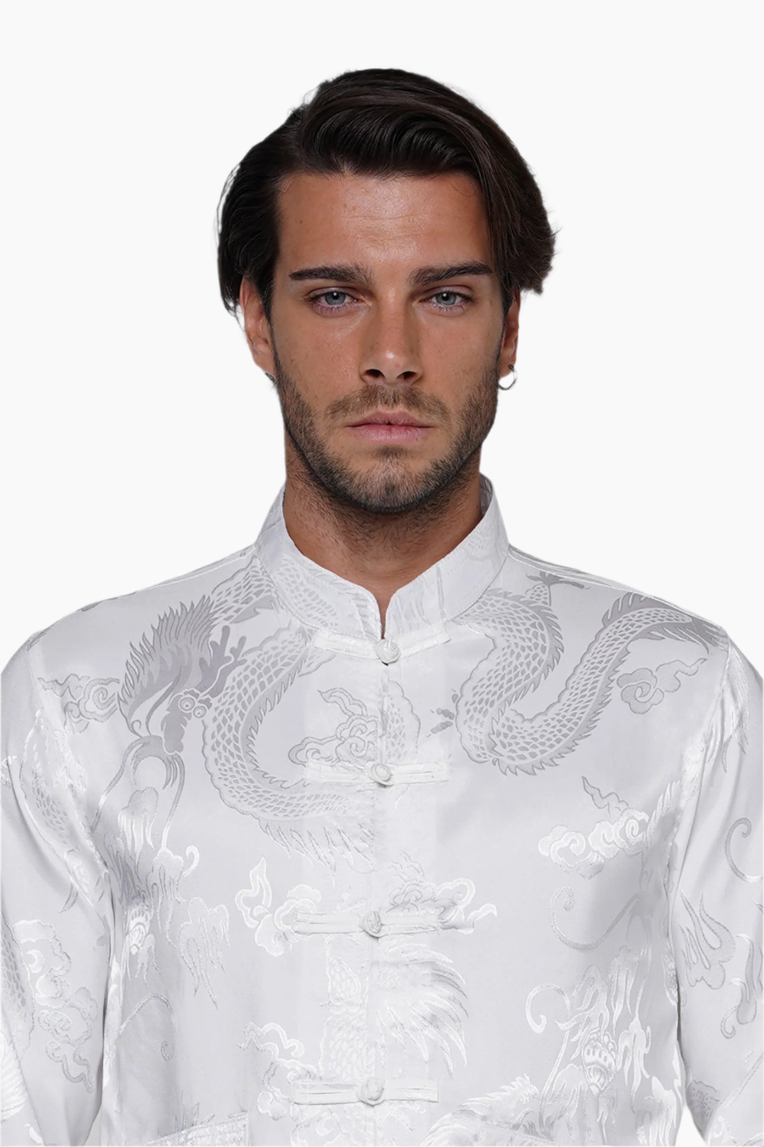 Man wearing a white embroidered shirt with dragon design