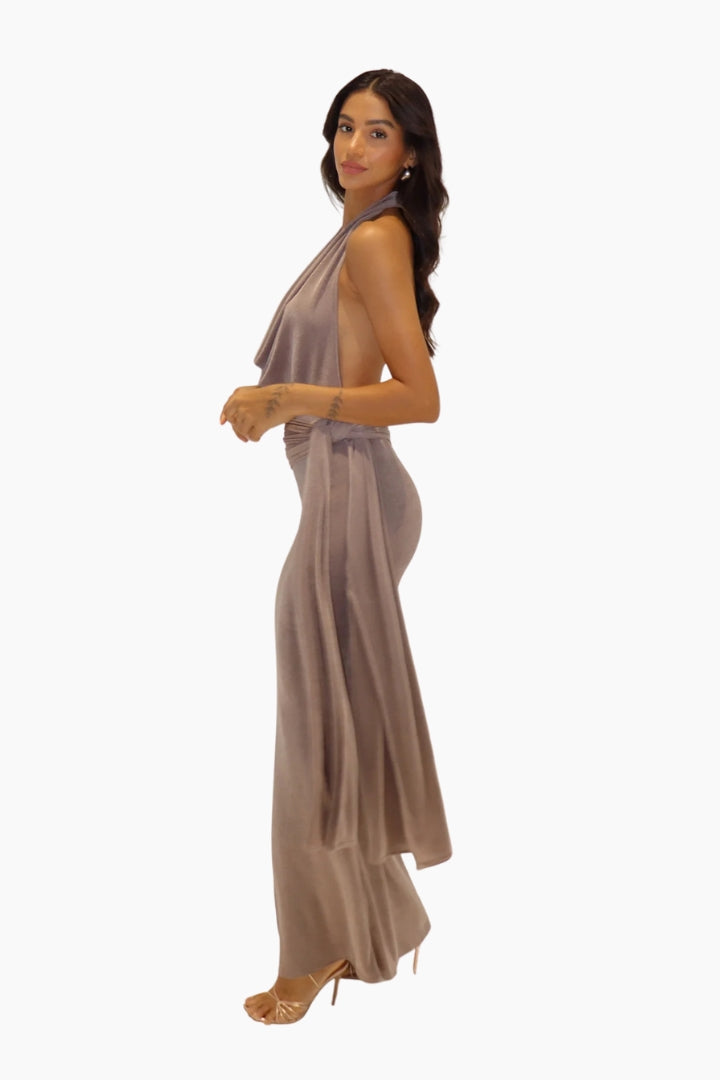 Woman wearing a long, flowing dress on a white background