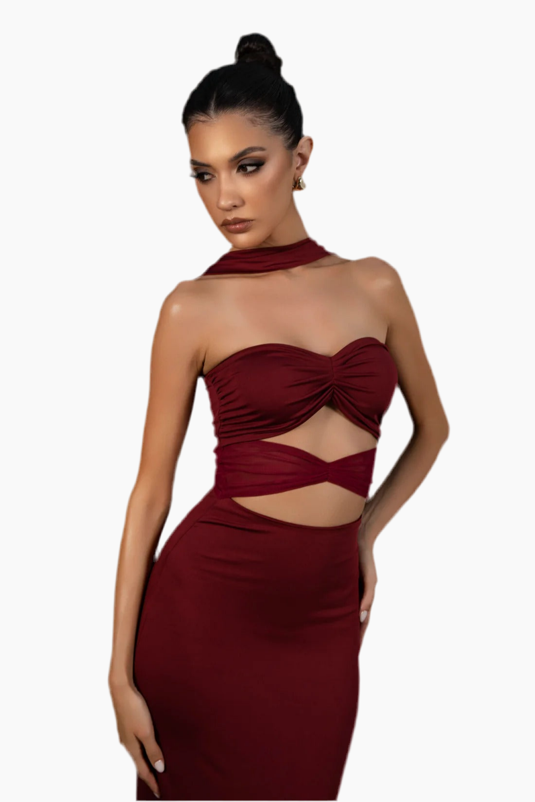 Woman wearing a burgundy dress with cut-out design.