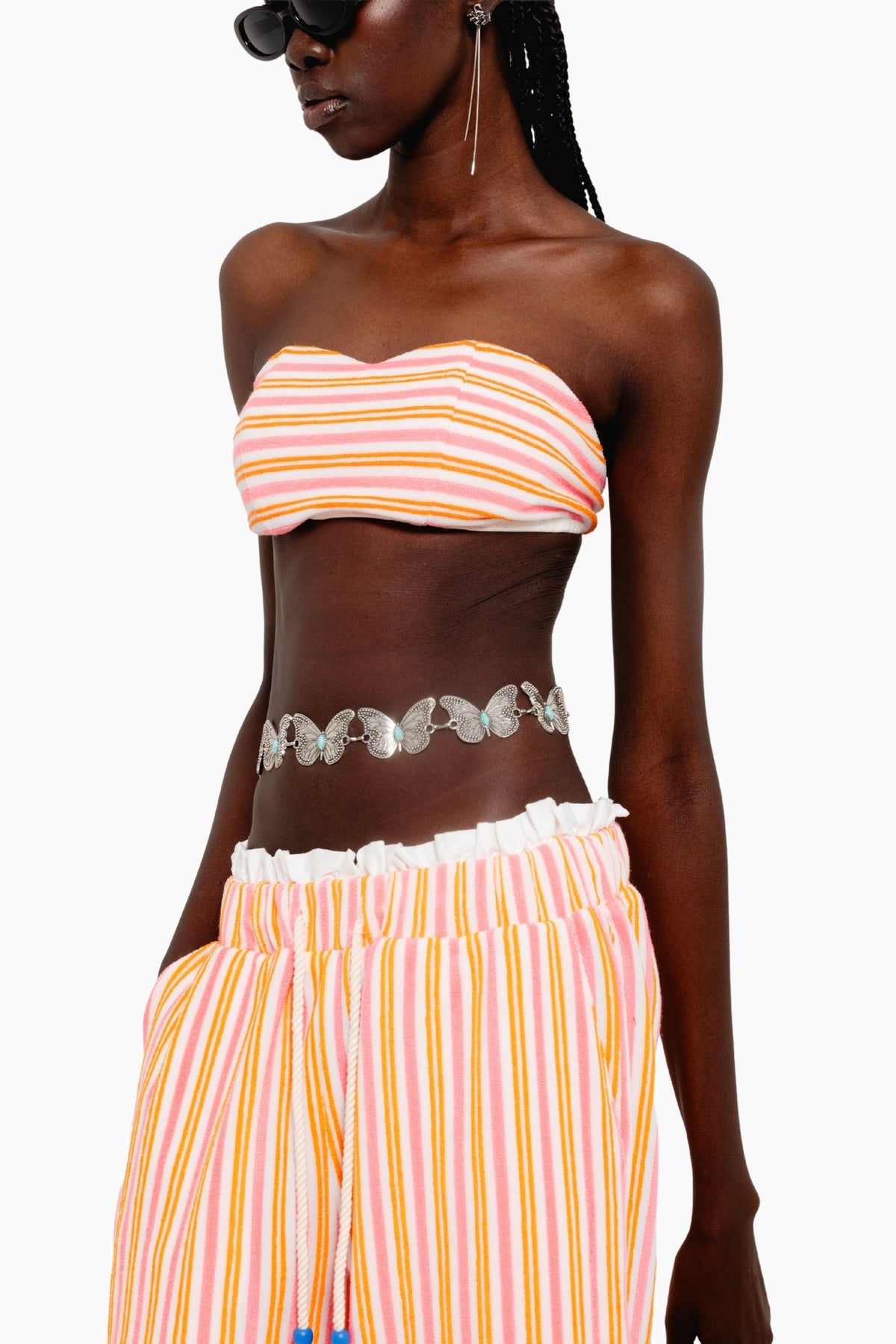 Woman wearing a colorful striped outfit