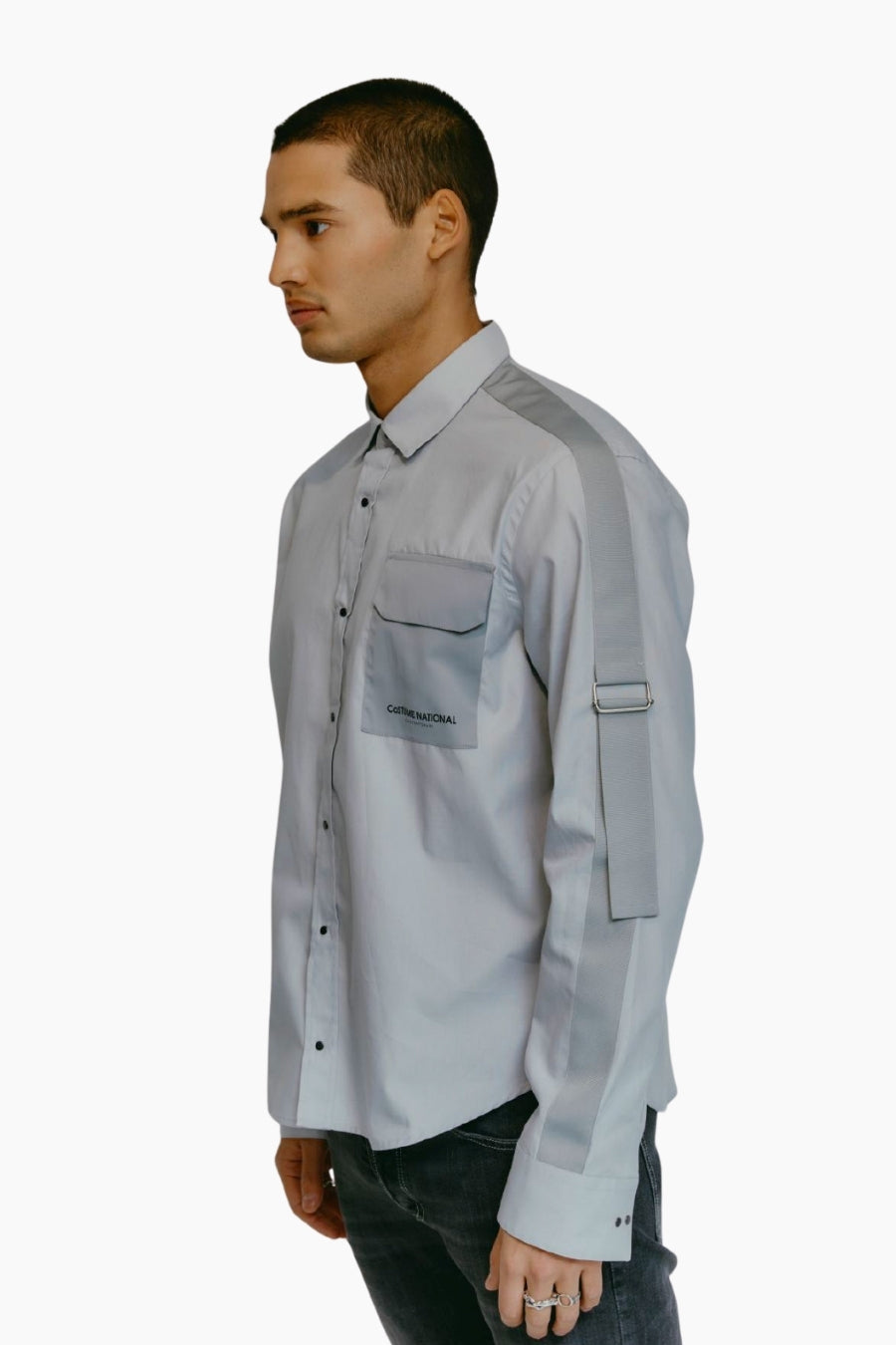 Model wearing a light blue shirt with a side pocket