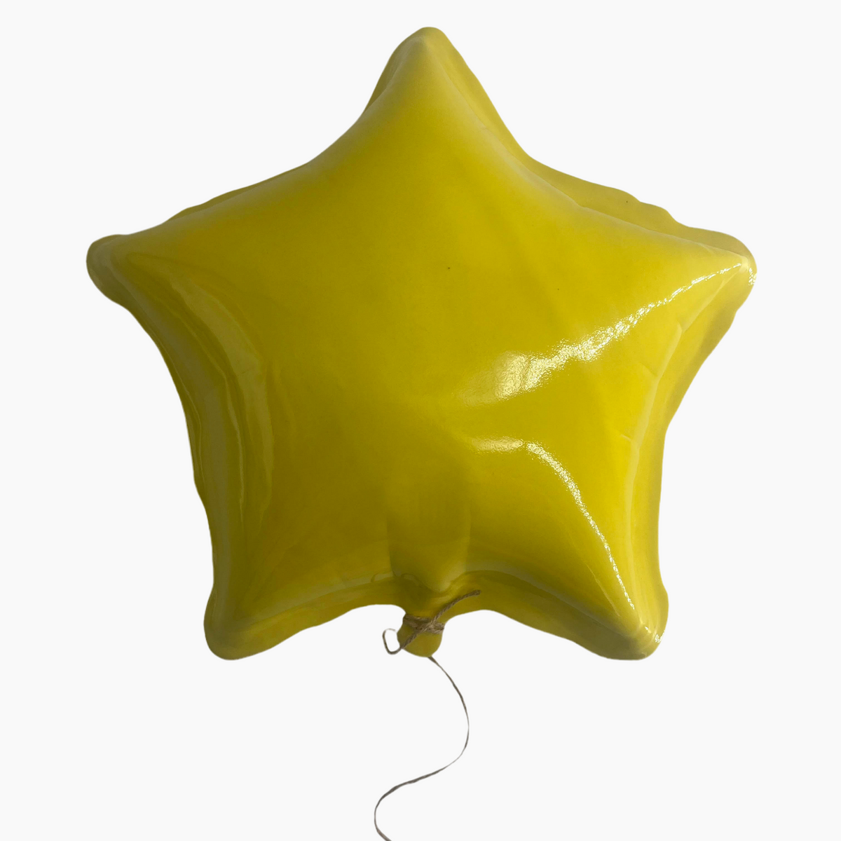 Yellow star-shaped balloon.