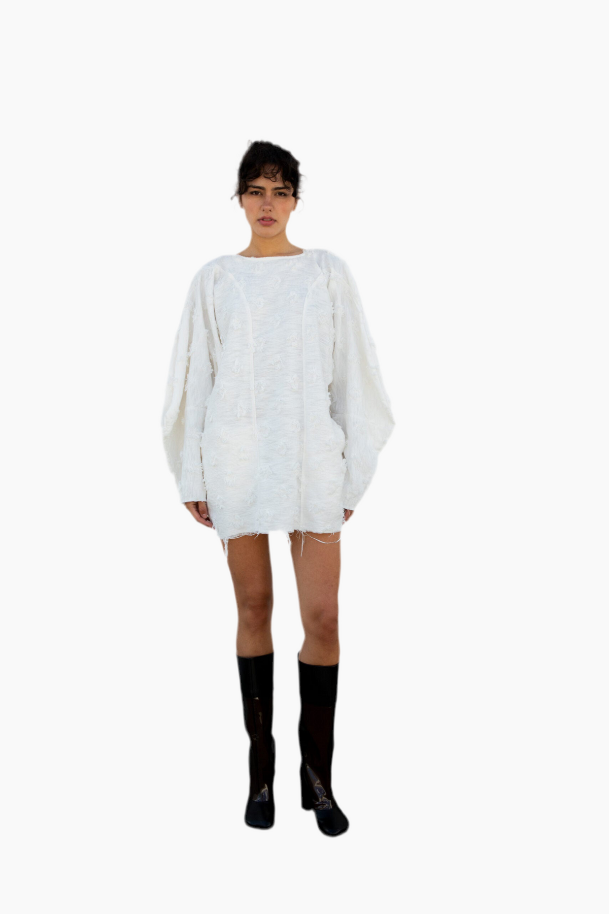 Person wearing a white sweater and black socks