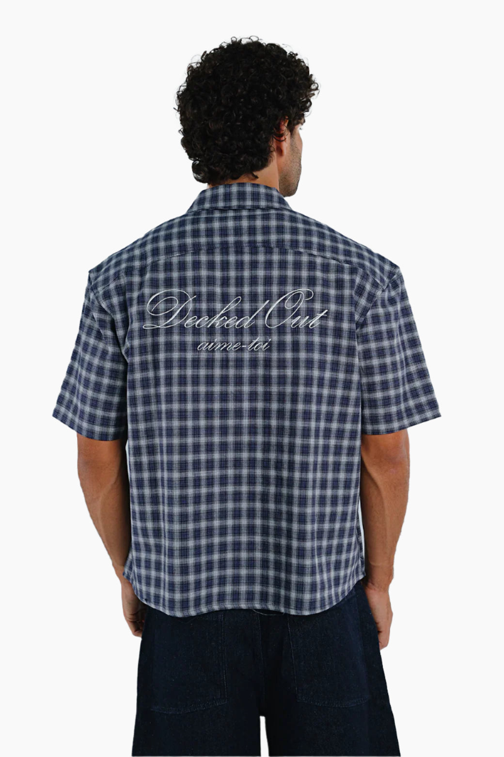 Man wearing a blue and white checkered shirt