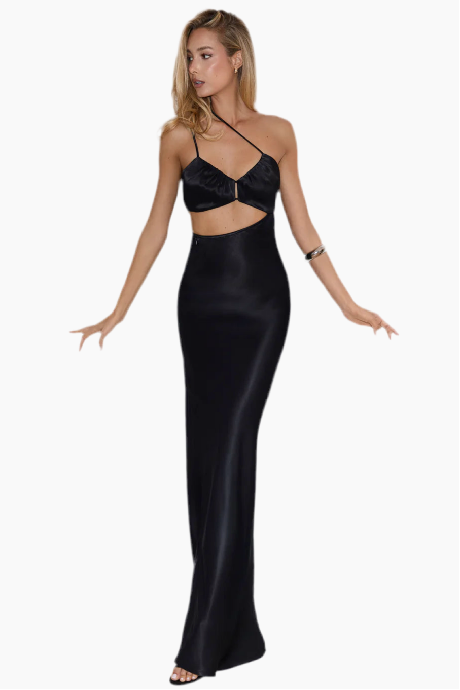Woman wearing a black dress with cut-out design.