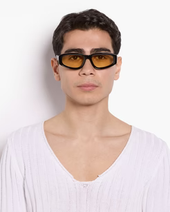 Man wearing a black, yellow tinted sunglasses
