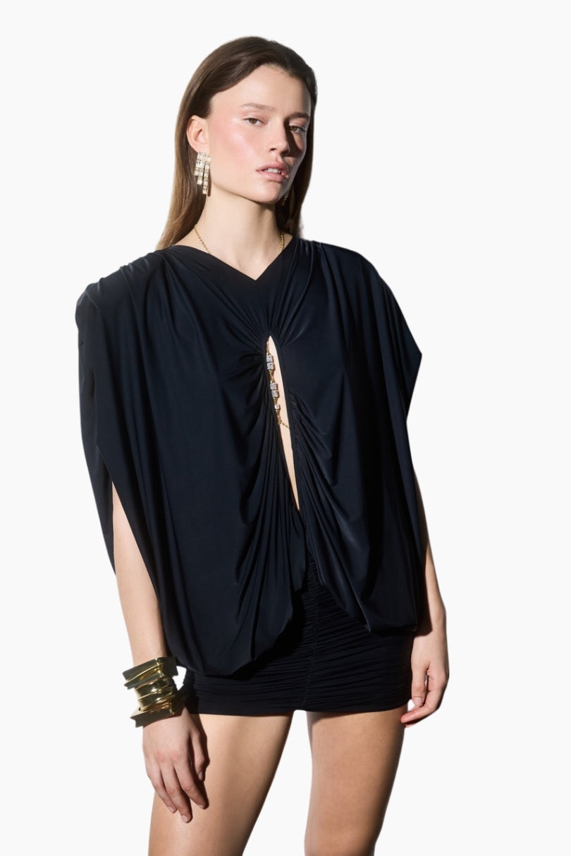 Draped mini dress. Featuring statement shoulders and a bold front cut-out detail. Designed with a bodycon draped mini skirt to highlight a feminine silhouette.