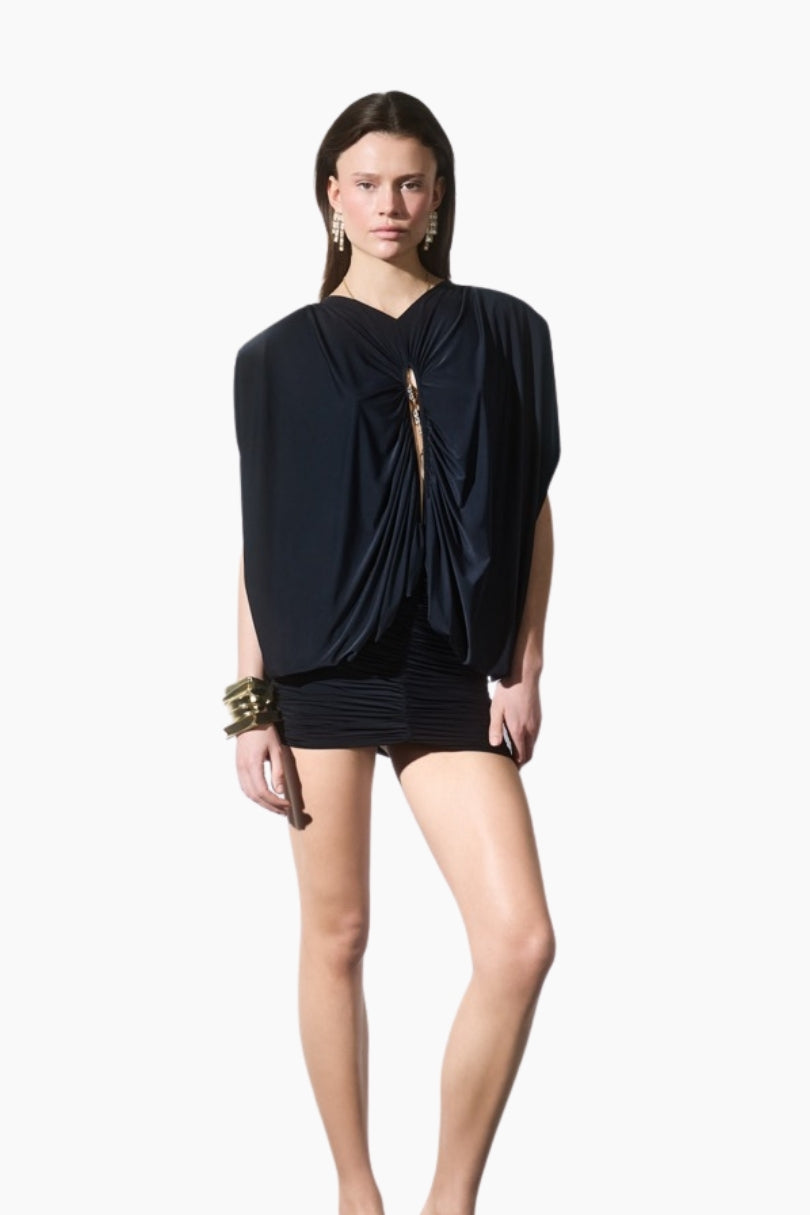 Draped mini dress. Featuring statement shoulders and a bold front cut-out detail. Designed with a bodycon draped mini skirt to highlight a feminine silhouette.